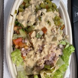 Bowl with lettuce, rice, hummus, potatoes, chicken, pickles and pickles turnips, and spicy tahini on top! Bowl with lettuce, rice, hummus, potatoes, chicken, pickles and pickles turnips, and spicy tahini on top!