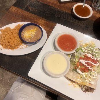Poblano's Mexican Bar & Grill - burrito chicken and refried beans, ground beef and refried beans with a side of refried beans, a yellow rice as well as a side of queso dip. - Mexican Near Me - Bradenton, Florida