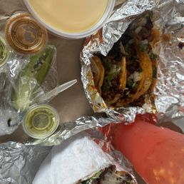 Watermelon Agua fresca, tacos de Al pastor. Torta Cubans, and jello desert.