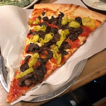 Talarico's Pizzeria - West Side slice with pepperocinis added. - Pizza Near Me - Seattle, Washington Talarico's Pizzeria - West Side slice with pepperocinis added. - Pizza Near Me - Seattle, Washington