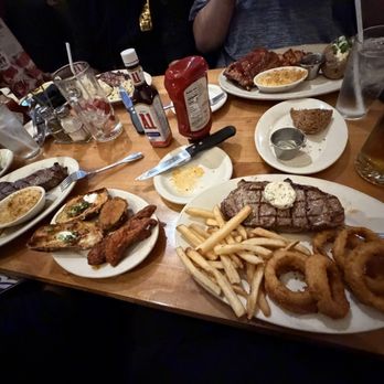 Black Angus Steakhouse - New York Strip 12 Oz with butter and garlic. 2 sides of fries and onion rings! - Steakhouses Near Me - Ontario, California Black Angus Steakhouse - New York Strip 12 Oz with butter and garlic. 2 sides of fries and onion rings! - Steakhouses Near Me - Ontario, California