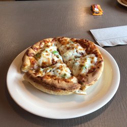 Godfather's Pizza - Mini pizza. Super cheap and comes with two toppings. This ones chicken and green pepper.