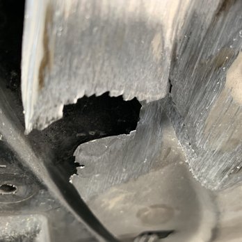 Jiffy Lube Oil Change - Damaged engine splash guard, from them not putting the screw back - Auto Repair Near Me - Norco, California