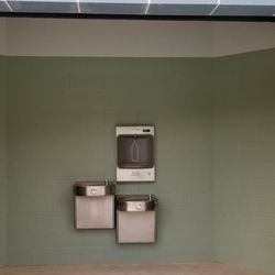 Hilliard East Municipal Pool - Bathroom entrance, with two drinking fountains and a water bottle filler.