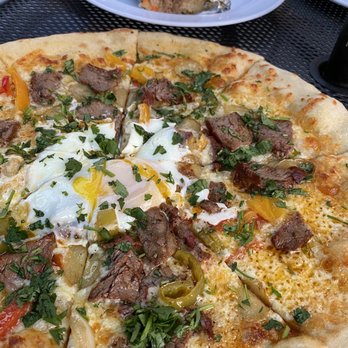 Iron Goat Brewing - Steak and egg pizza, half of a bahn mi burrito - Breweries Near Me - Spokane, Washington Iron Goat Brewing - Steak and egg pizza, half of a bahn mi burrito - Breweries Near Me - Spokane, Washington