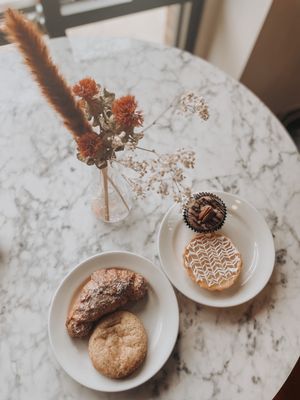 Photo of Passion Flour - Salt Lake City, UT, US. Almond croissant, Snickerdoodle Cookie, lemon tart, muddy German Chocolate Cupcake.