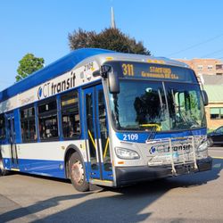 Glory Days Diner - Glory Days is the place in the background with the shades half down as a CTTransit route 311 bus works toward Stanford