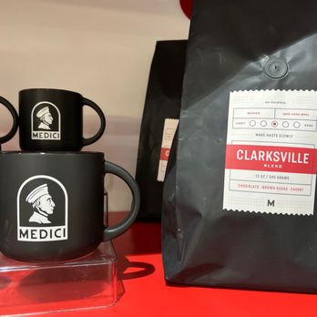 Caffe Medici - a bag of coffee and two mugs - Cafes Near Me - Austin, Texas Caffe Medici - a bag of coffee and two mugs - Cafes Near Me - Austin, Texas