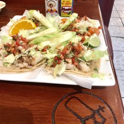El Taco Grande - You know it's legit when there's a boot brand on the table, also the hot sauce