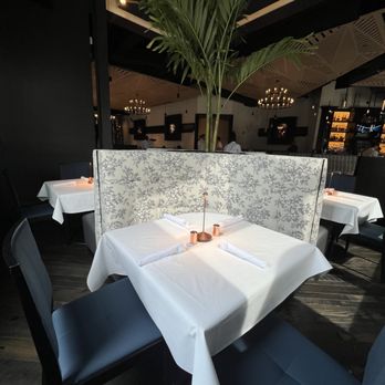 Epic Chophouse - The tables by the windows are romantic for couples...nice. - Seafood Near Me - Greensboro, North Carolina Epic Chophouse - The tables by the windows are romantic for couples...nice. - Seafood Near Me - Greensboro, North Carolina