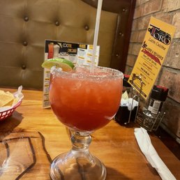 a drink in a glass on a table
