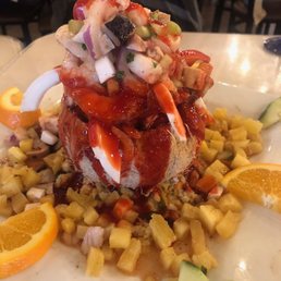 Ceviche with shrimp, octopus, fish scallops mango & coconut.