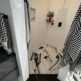 Beb Construction - a black and white bathroom - General Contractors Near Me