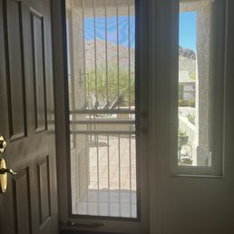 Security screen door and adjacent window.