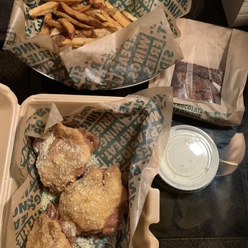 Wingstop - two trays of food on a table - Chicken Wings Near Me - Lawrence, Kansas