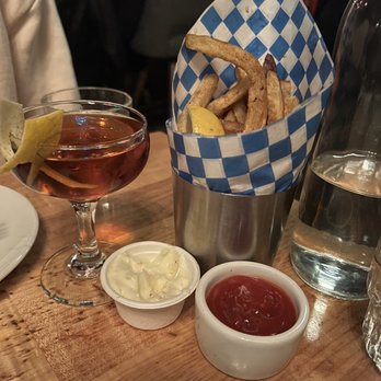 Damn the Weather - Duck Fat Fries (partially eaten) and Tiny Chance - Cocktail Bars Near Me - Seattle, Washington Damn the Weather - Duck Fat Fries (partially eaten) and Tiny Chance - Cocktail Bars Near Me - Seattle, Washington