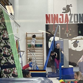 Planet Gymnastics - My daughter climbing the ladder and teacher Meg - Gymnastics Near Me - Sacramento, California