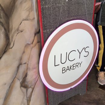 Lucy’s Bakery - Lucy's sign at the corridor entrance to the courtyard. - Bakeries Near Me - Skagway, Alaska Lucy’s Bakery - Lucy's sign at the corridor entrance to the courtyard. - Bakeries Near Me - Skagway, Alaska