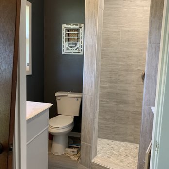 VAS Contracting - a bathroom with a toilet and shower - Flooring Near Me - Victoria, Texas VAS Contracting - a bathroom with a toilet and shower - Flooring Near Me - Victoria, Texas