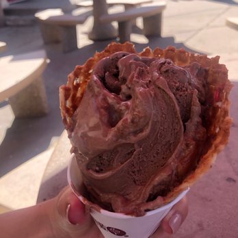Cold Stone Creamery - a hand holding a cone of ice cream - Ice Cream & Frozen Yogurt Near Me - Albuquerque, New Mexico