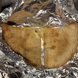 Ricotta calzone. Looks puffier than it was. Ricotta calzone. Looks puffier than it was.