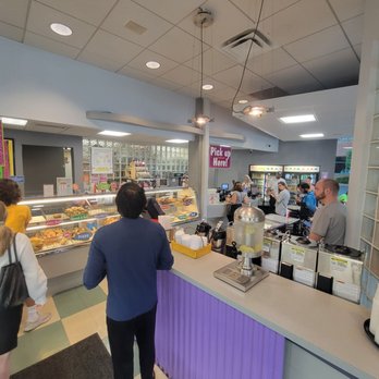 Bagel Cafe - The water station and coffee behind it. People waiting to order on left and people picking up orders on the right. - Bagels Near Me - Herndon, Virginia Bagel Cafe - The water station and coffee behind it. People waiting to order on left and people picking up orders on the right. - Bagels Near Me - Herndon, Virginia