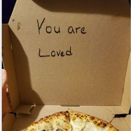 a pizza in a box that says you are loved a pizza in a box that says you are loved