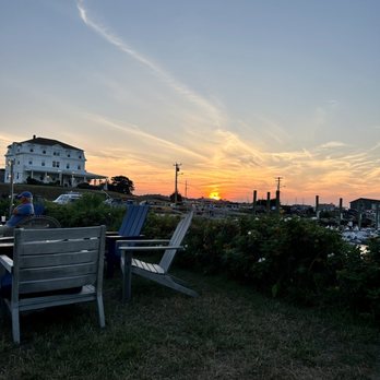 Dead Eye Dick's - Sitting outside on the lawn in the rear of the restaurant, watching the sunset from Adirondack chairs. Beautiful view, 5 stars. - New American Near Me - Block Island, Rhode Island