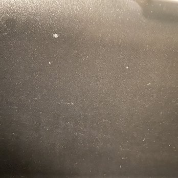 Project X Restoration - White splashed on sink from mixing the stuff to stick tiles on. It permanently stained sink - Damage Restoration Near Me - Denver, Colorado