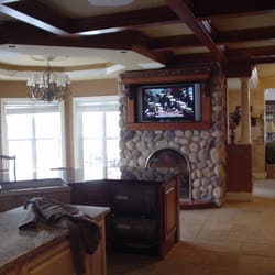 We Build Arkansas - Custom fireplace installed with set tv stone finish.
