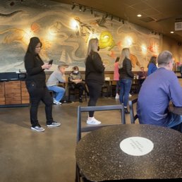 a group of people in a coffee shop a group of people in a coffee shop