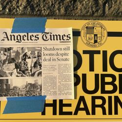 Sign posted with current day newspaper as City of Los Angeles Requires.