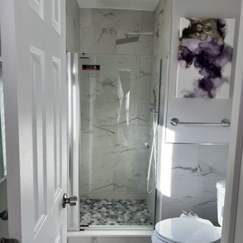 Renotec - a bathroom with a toilet and shower - General Contractors Near Me Renotec - a bathroom with a toilet and shower - General Contractors Near Me