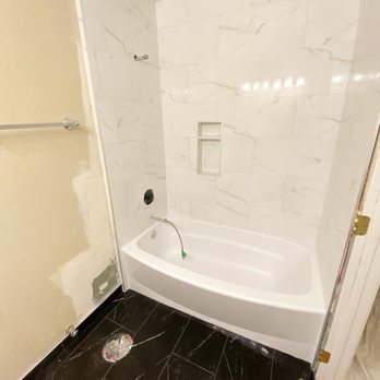 Pro Floors and Walls - a bathtub and shower - Tiling Near Me Pro Floors and Walls - a bathtub and shower - Tiling Near Me
