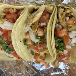 Chicken Tacos - Three chicken tacos filled with grilled chicken, diced tomatoes, onions, and cilantro, served on soft corn tortillas at Sabor 3 Colores in Middlesex, NJ.