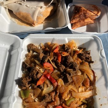 Buraka - Dorowot with injera (top left), tibs with rice (bottom), samosas (top right) - Ethiopian Near Me - Madison, Wisconsin