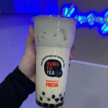 Kung Fu Tea - a hand holding a cup of milk tea - Bubble Tea Near Me - Malden, Massachusetts Kung Fu Tea - a hand holding a cup of milk tea - Bubble Tea Near Me - Malden, Massachusetts