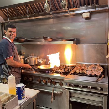 Brick Oven Pizza & Restaurant - a man preparing food - Italian Near Me - New Britain, Connecticut Brick Oven Pizza & Restaurant - a man preparing food - Italian Near Me - New Britain, Connecticut