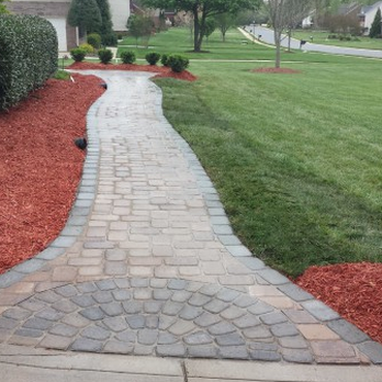 Manny Landscaping - a brick walkway in front of a house - Landscaping Near Me - Aurora, Illinois