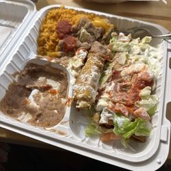 La Pasadita Restaurant - Chicken flautas, Mexican rice, and I mixed the beans in. Nice bite. It's got just the right amount of heat.