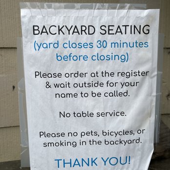 Devil’s Teeth Baking Company - Backyard seating sign at Devil's Teeth Baking Company in San Francisco. - Bakeries Near Me - San Francisco, California Devil’s Teeth Baking Company - Backyard seating sign at Devil's Teeth Baking Company in San Francisco. - Bakeries Near Me - San Francisco, California