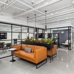 Venture X Washington DC - Open workspace by 3 of our meeting rooms & in front of the Duke Ellington Training Room