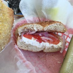 Whole wheat sesame bagel with light scallion cream cheese.