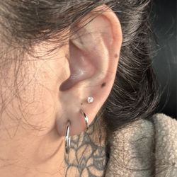 Piercing Pagoda - Top hole was the new piercing ($75 for the studs) promo was a free piercing.