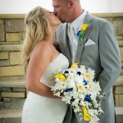 Artistic Floral Design - Brides Cascade with large orchids, yellow calla lilies, white small orchids and blue orchids.  At the Stonegate.