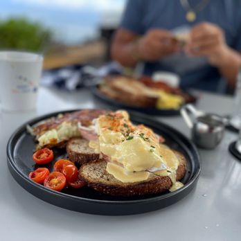 Mala Ocean Tavern - Eggs Benedict with ham and potatoes. - Seafood Near Me - Lahaina, Hawaii Mala Ocean Tavern - Eggs Benedict with ham and potatoes. - Seafood Near Me - Lahaina, Hawaii