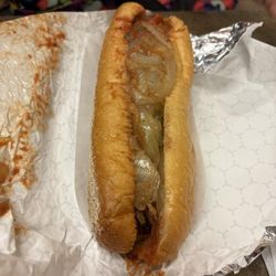 Hot sausage sandwich with onions and peppers and marinara sauce combo