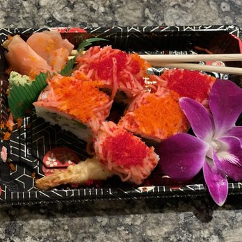 Mr. G. Sushi - a plate of sushi with chopsticks - Sushi Bars Near Me Mr. G. Sushi - a plate of sushi with chopsticks - Sushi Bars Near Me