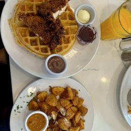 Chicken and waffles with Nutella and side of potatoes well done. Fresh Squeezed OJ