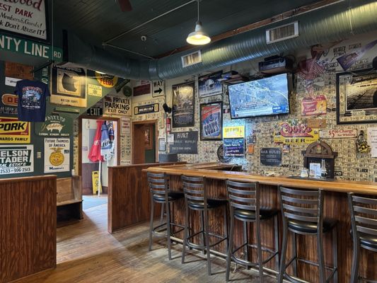 Photo of Dawg House Pizza - Monrovia, IN, US. Bar and back entrance from the patio and parking lot behind the building.